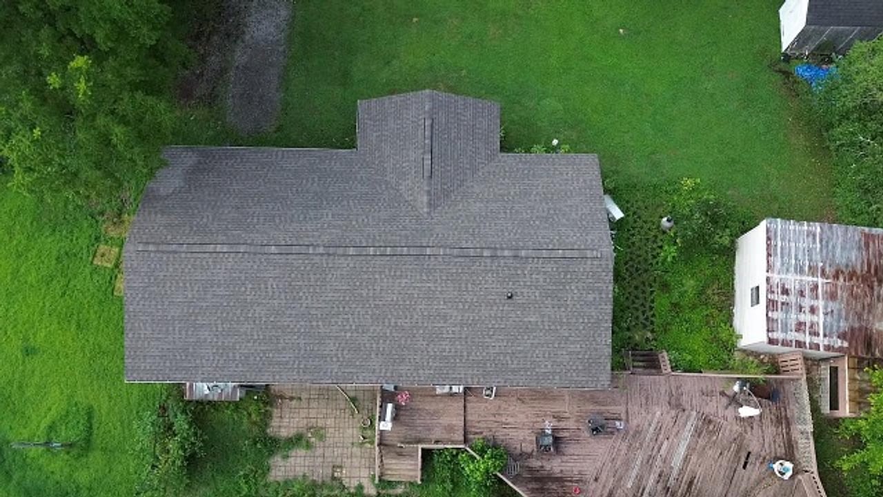Straight top-down drone view of the finished shingle roof