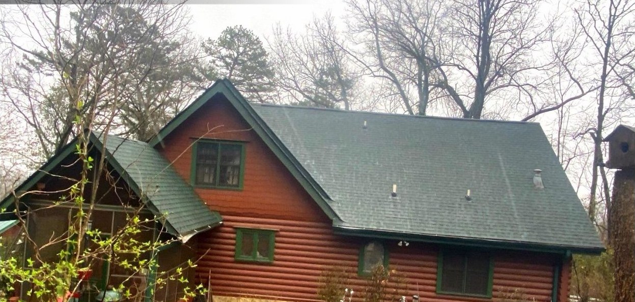 The same Signal Mountain log cabin with its new architectural shingle roof finished